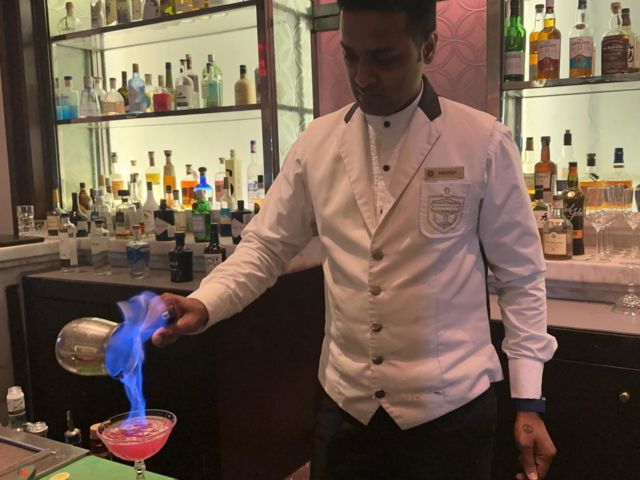 Flambé at the Harbour Bar - which I was told is the first licensed bar in all of India. 

Bombay Sapphire, guava, lemon, orange & clove 

This bar/hotel was also the site of terrorist attack in November of 2008 😯 worth a read, if you’re unfamiliar with the story. Learning about these attacks explains why there is an intense tsa-like security to enter most higher end hotels, in India. Because of the attack the Harbour Bar got a remodel - from wooden feathered to marble.